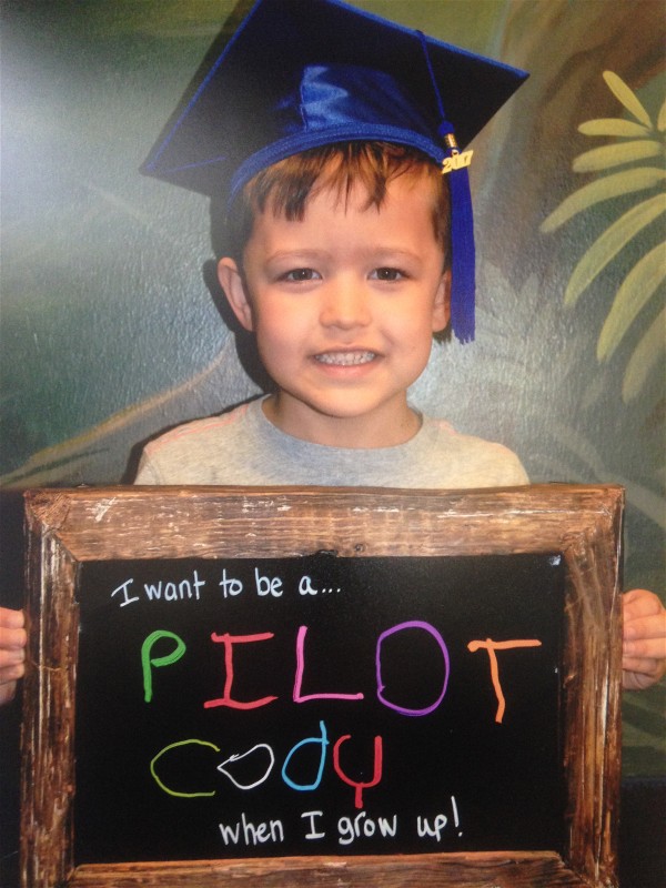 Cody in graduation hat