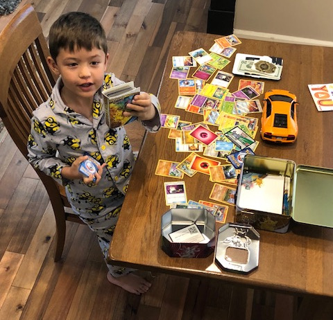 Cody with some of his Pokemon cards