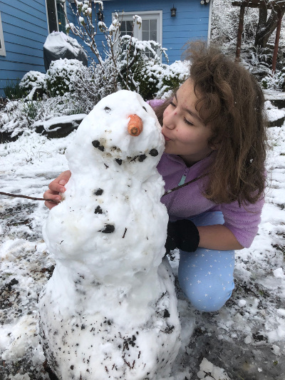 Marisol kissing her snowman