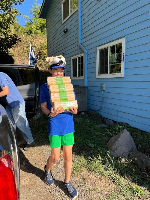Cody carrying 32 packs of spaghetti